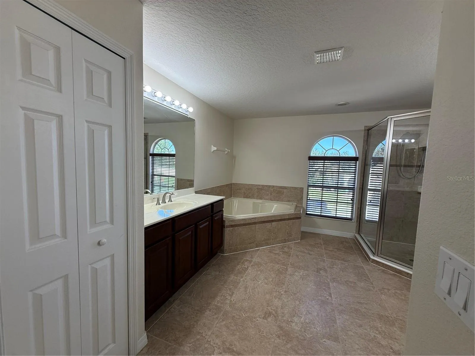 Tub with separate shower stall