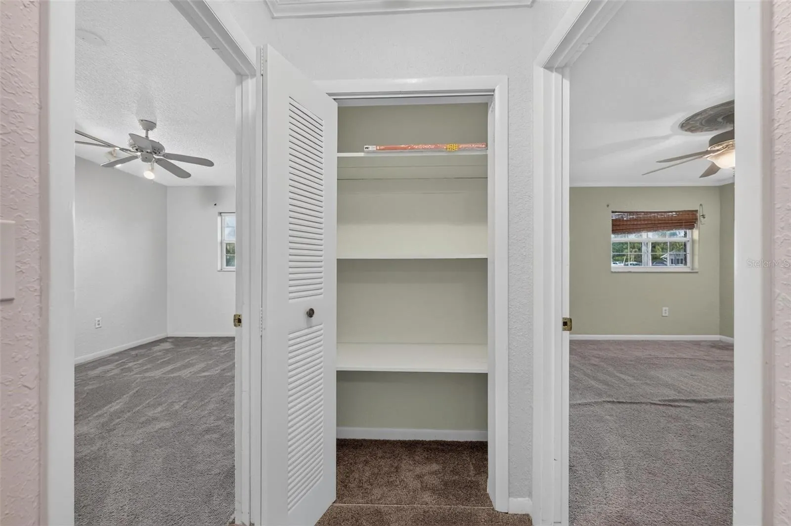 Hall Closet and adjacent bedrooms