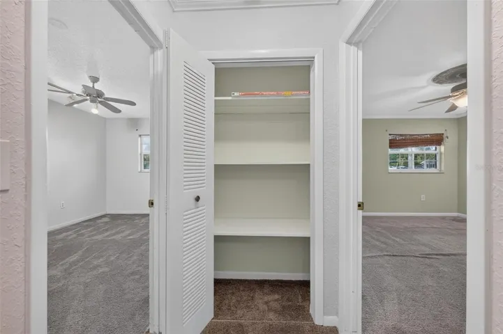 Hall Closet and adjacent bedrooms