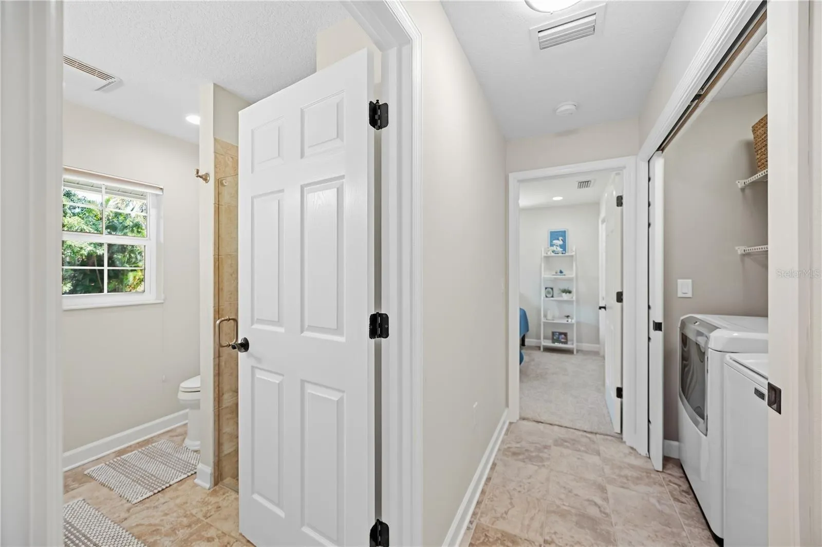 Guest quarter entrance with pocket door at entrance for maximum guest privacy