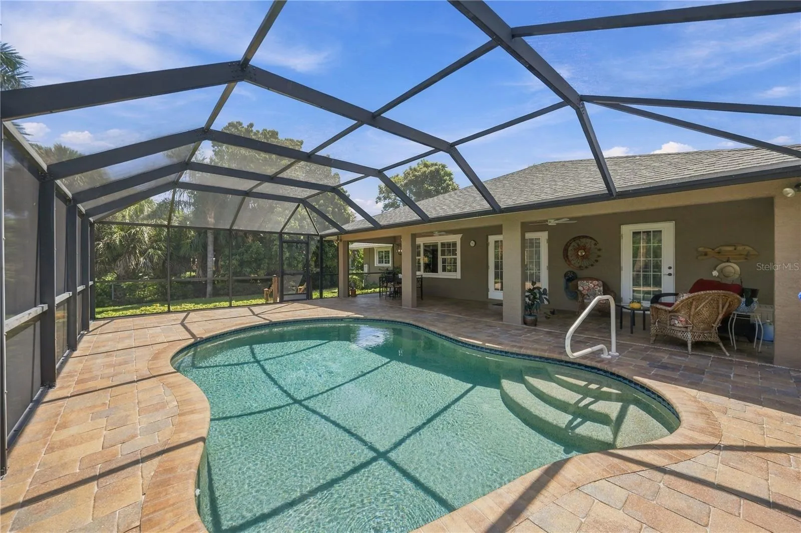 Saltwater heated pool and an abundance of covered and uncovered, screened in lanai space