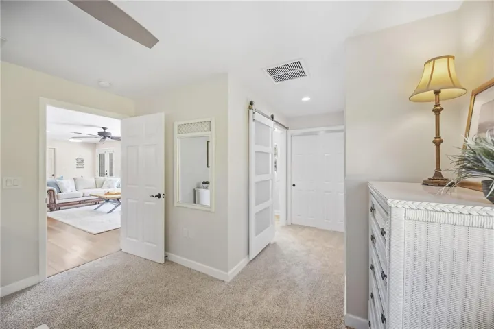 Modern barn door for bathroom, double closest with built-in shelves and hanging racks for ease of use for wardrobe and storage