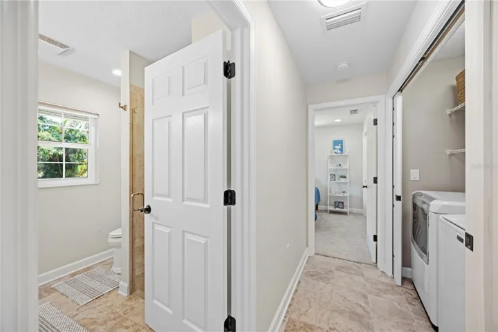 Guest quarter entrance with pocket door at entrance for maximum guest privacy