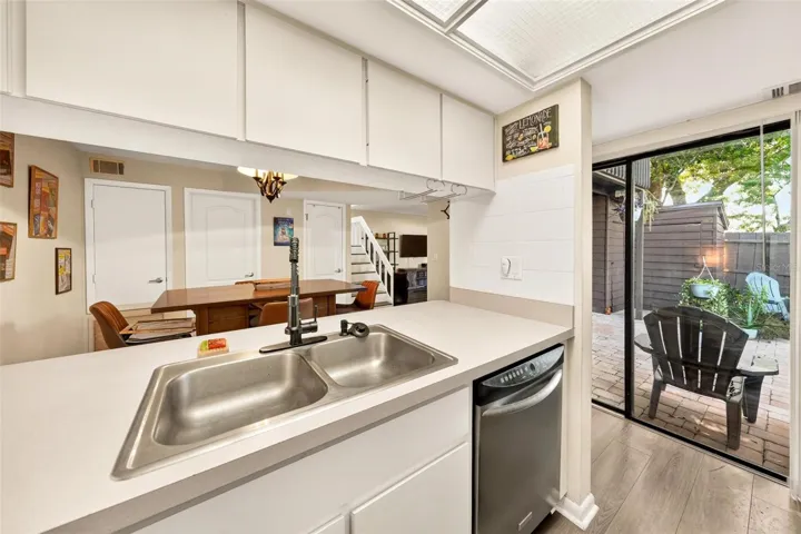 Kitchen with courtyard access through sliding glass doors.