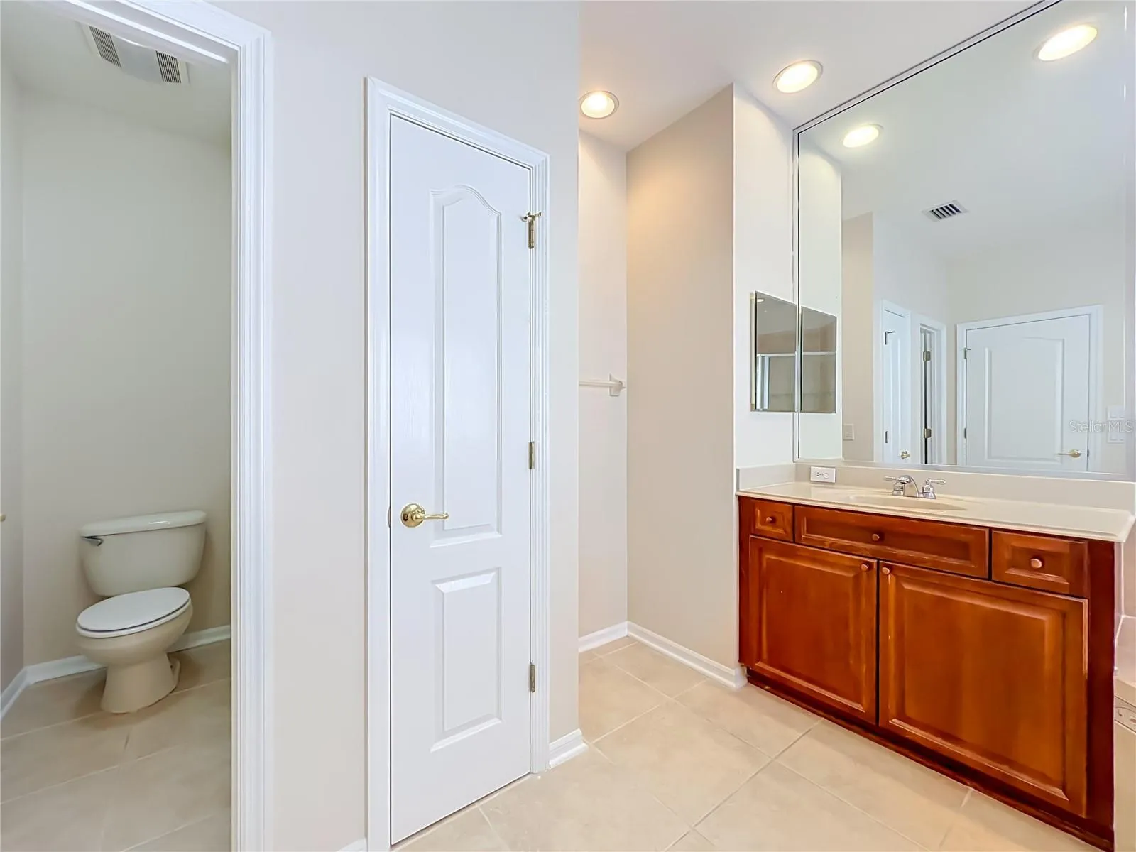 Primary bath Linen closet and water closet