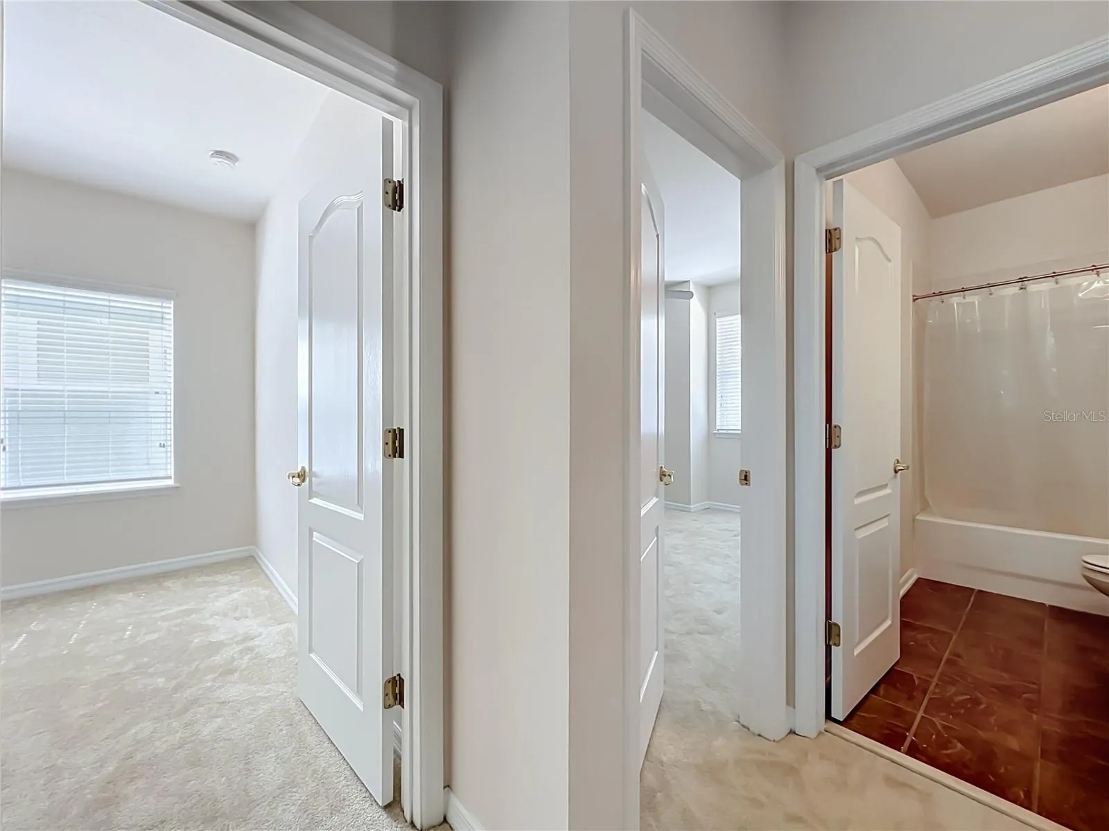 3 bedrooms at the end of the hall, and hall bath