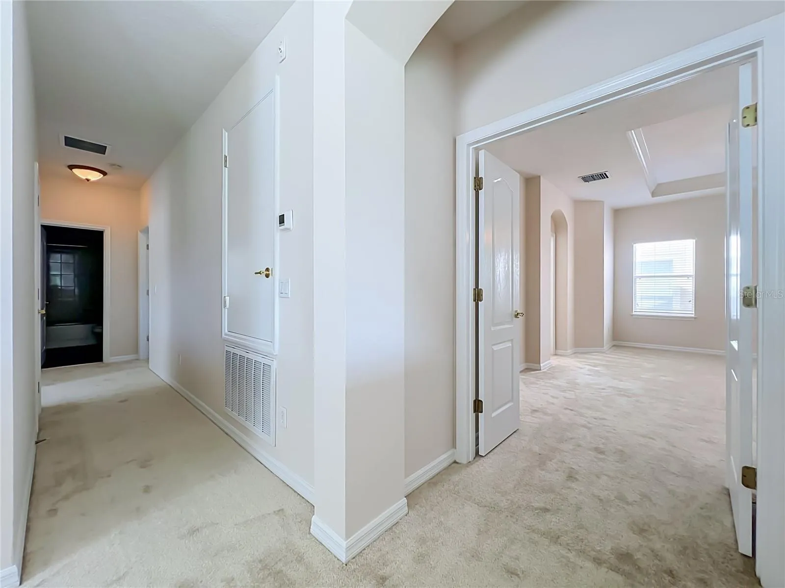 Primary bedroom with french door entry