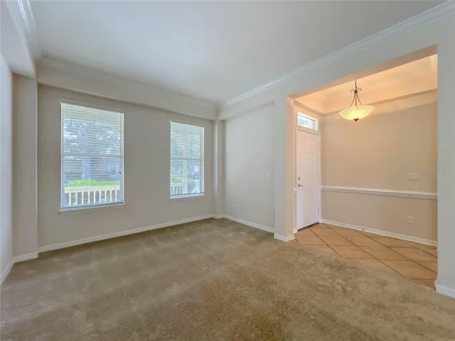 Tiled Front entry. Crown molding, freshly painted, new carpets in Living room area