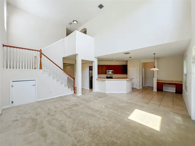 Family room/Kitchen/Dinette combination with 2-story ceiling