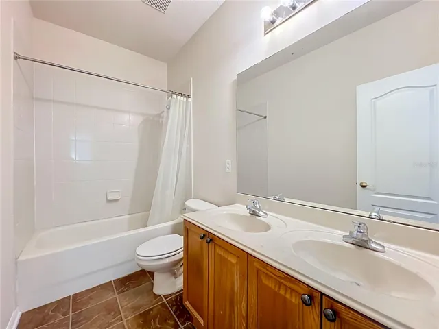 Hall closet features dual sinks