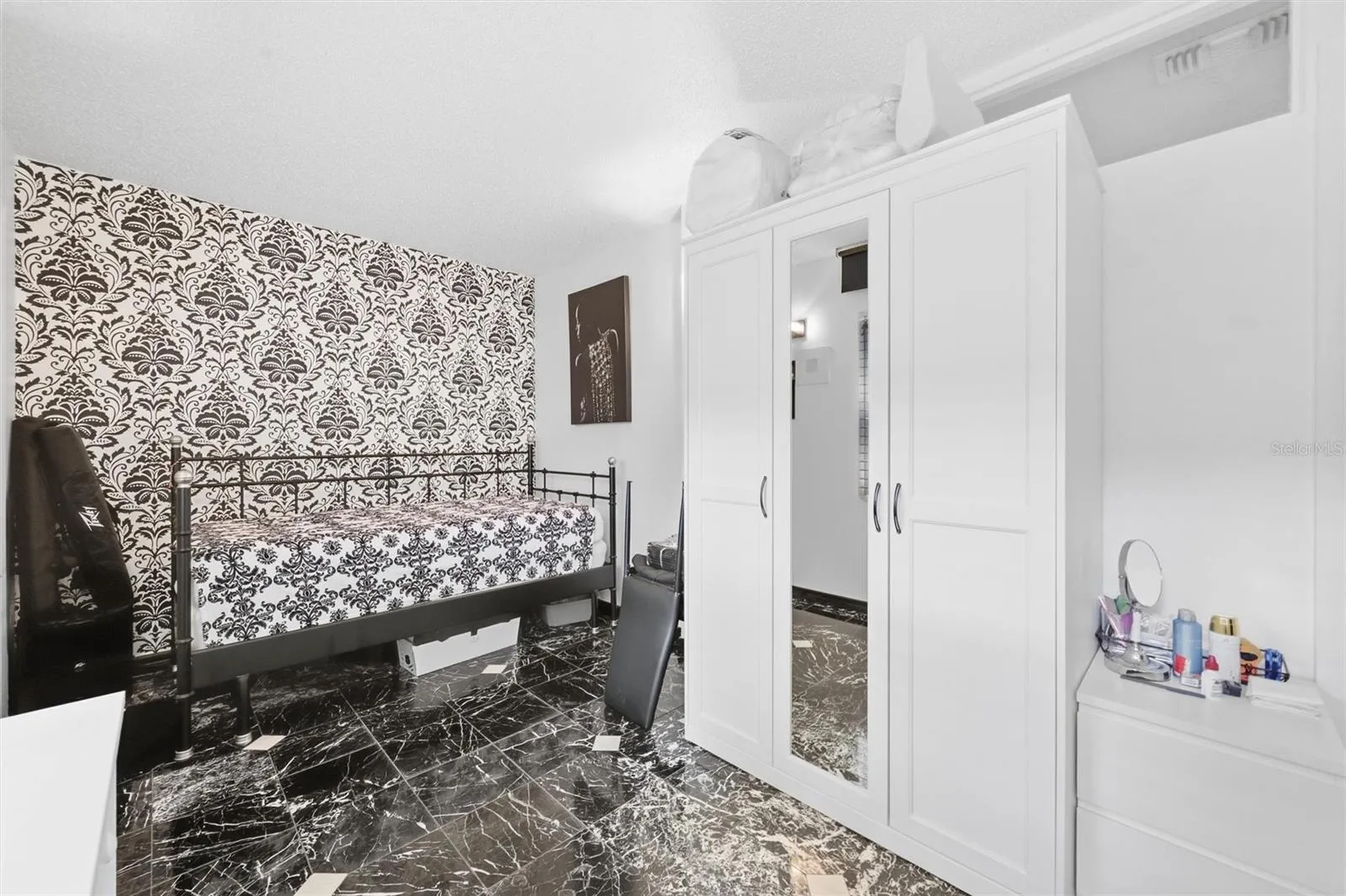 The Enclosed Florida Room, currently used as extra guest room.