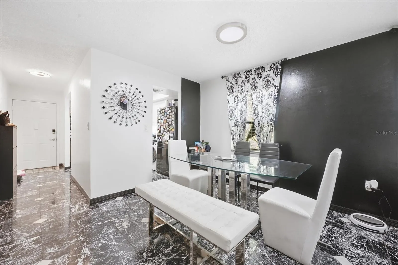 The entrance leading to the dining area and the living room.