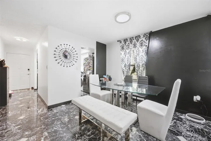 The entrance leading to the dining area and the living room.