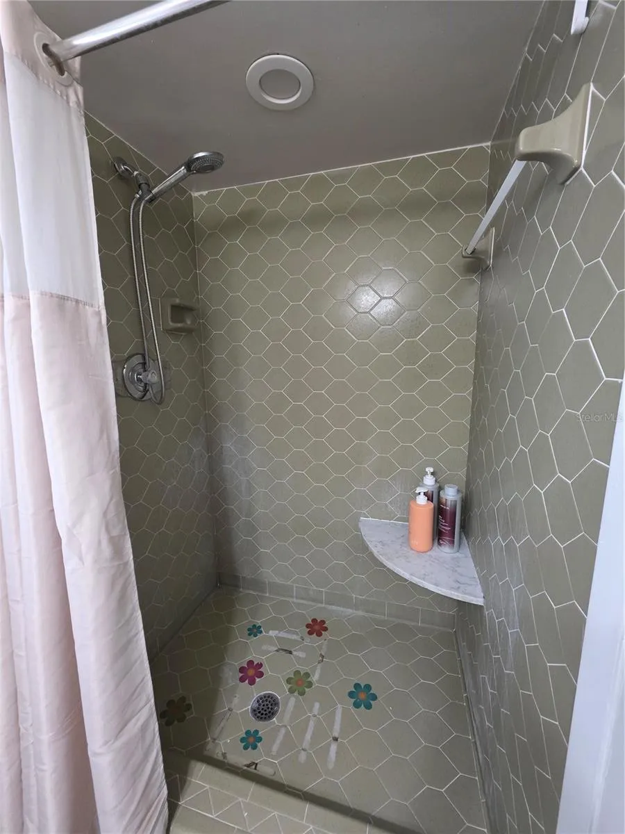 Walk in tiled shower with seat