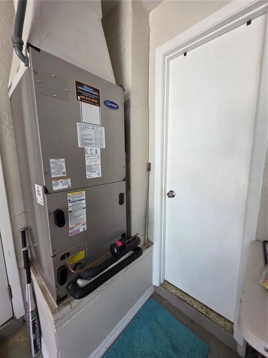Air handler and entrance to 2nd bathroom in garage.