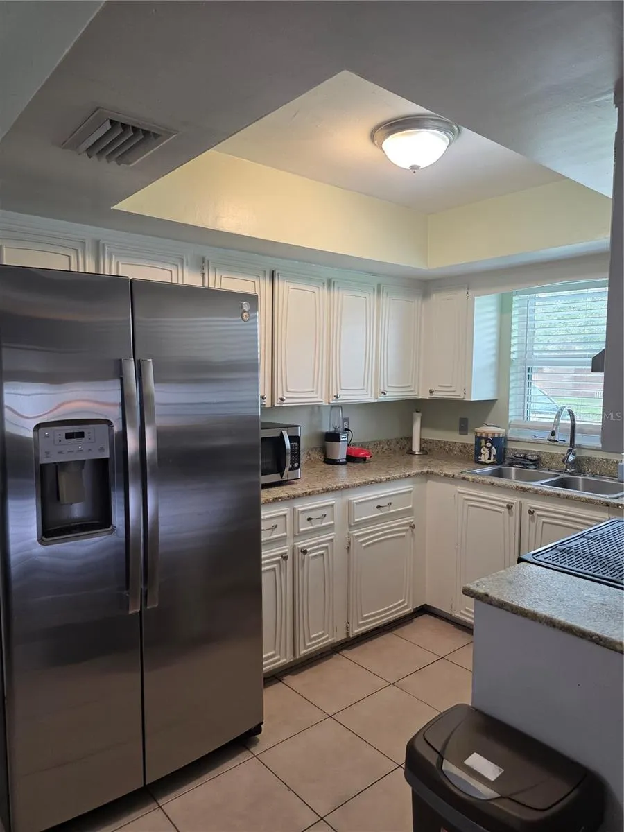 kitchen with tray ceiling