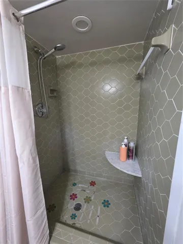 Walk in tiled shower with seat