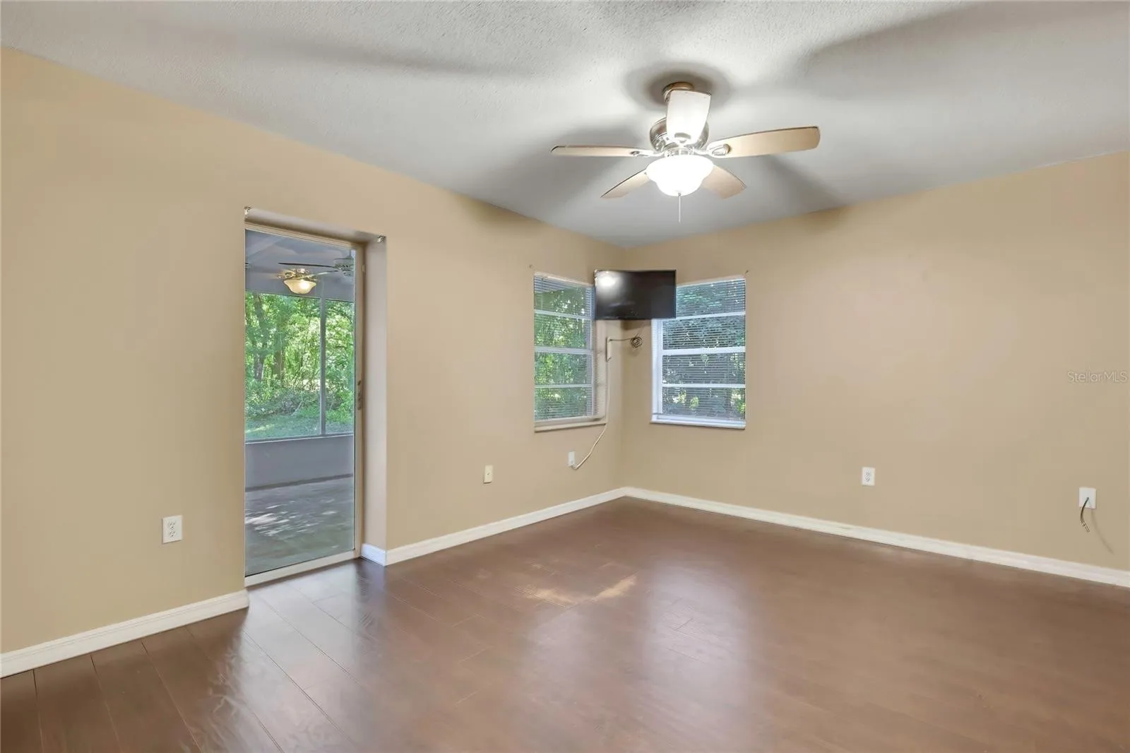 Bedroom with multiple windows and exterior access