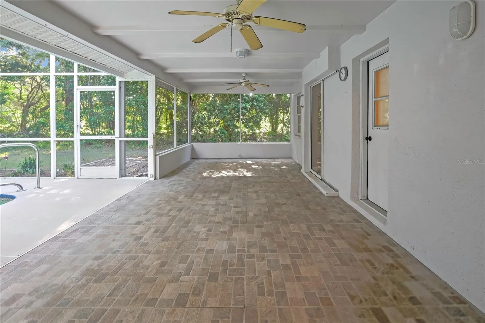 Expansive covered and screened outdoor living area