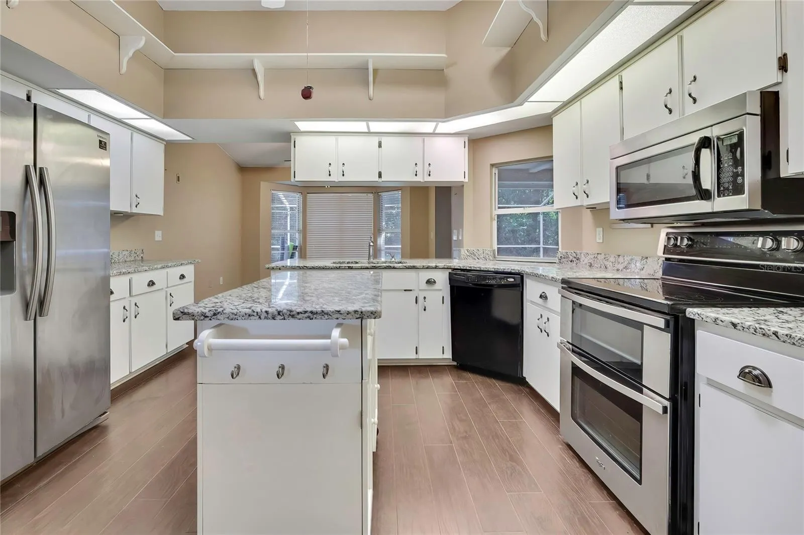 Spacious kitchen with center island and stainless-steel appliances