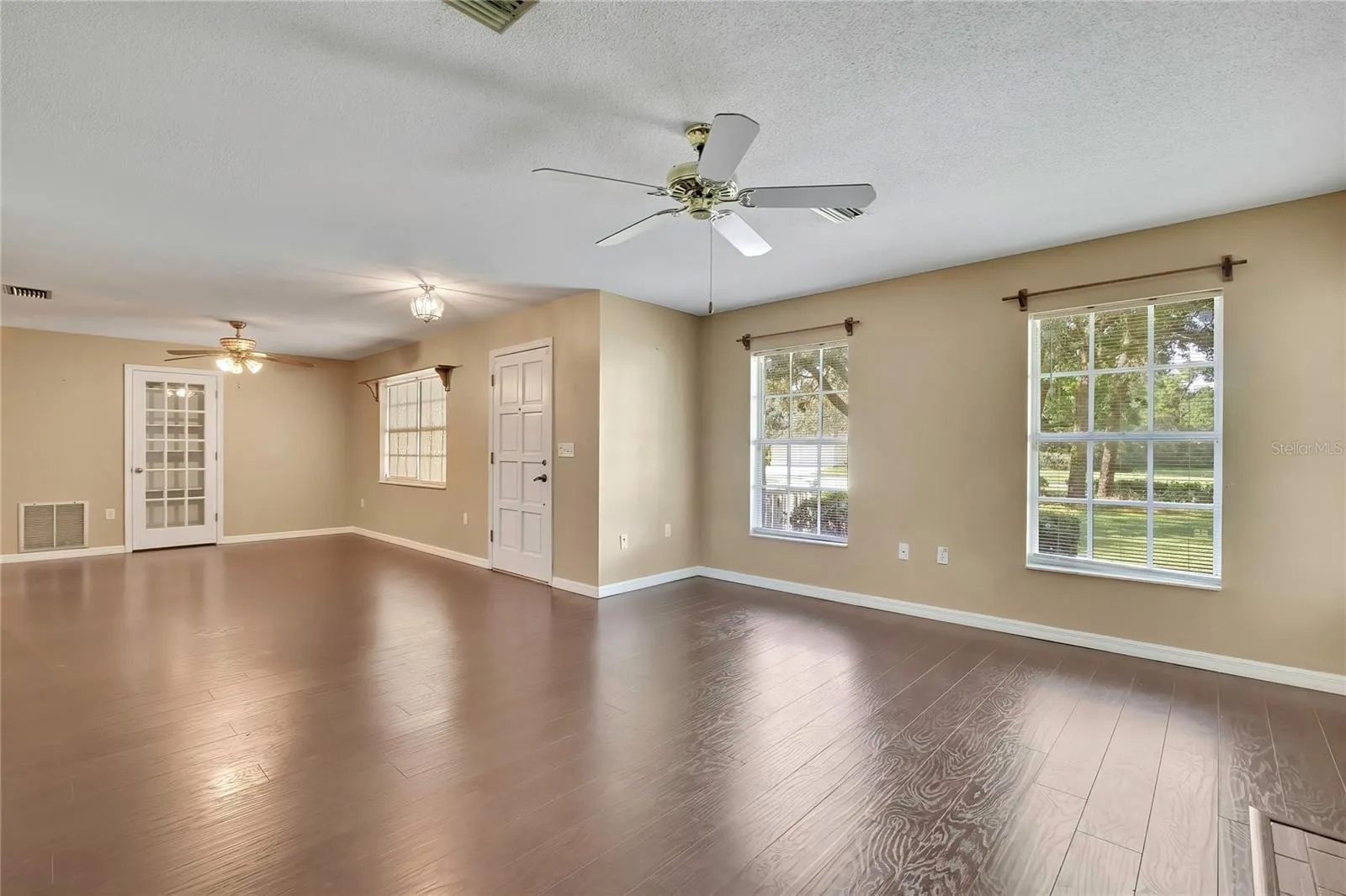 Open-concept living area with durable wood-look flooring