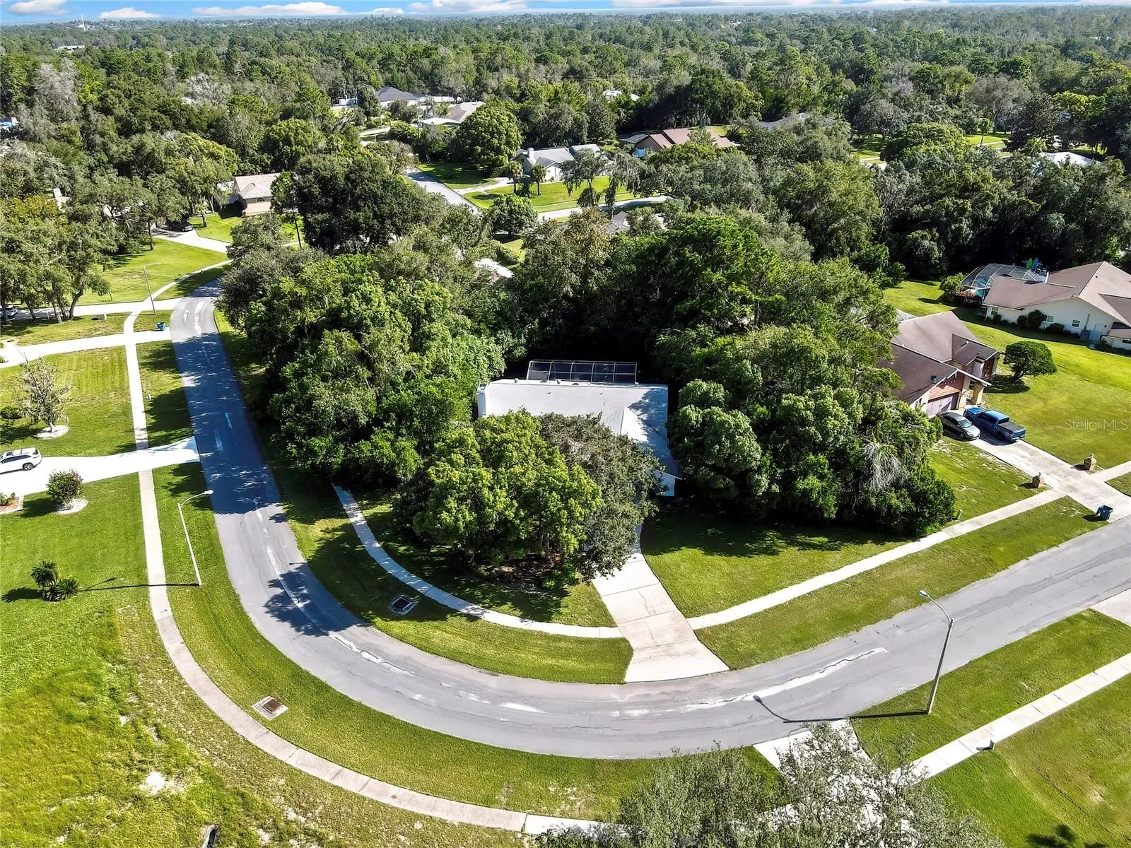 Aerial view highlighting the curved residential street