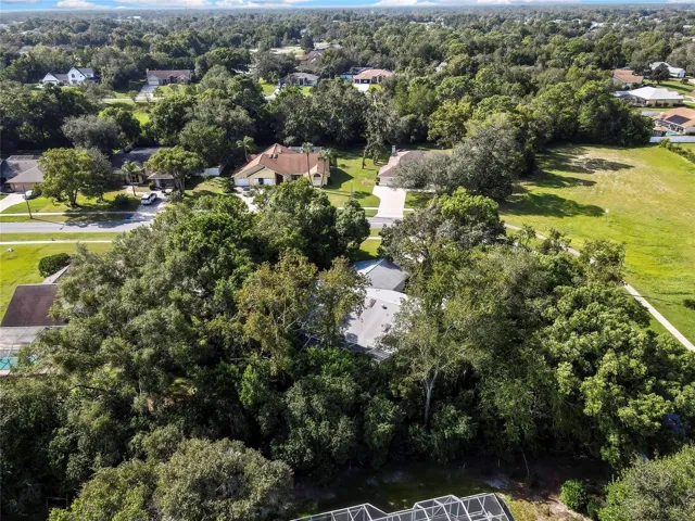 Aerial perspective of the property and surrounding neighborhood