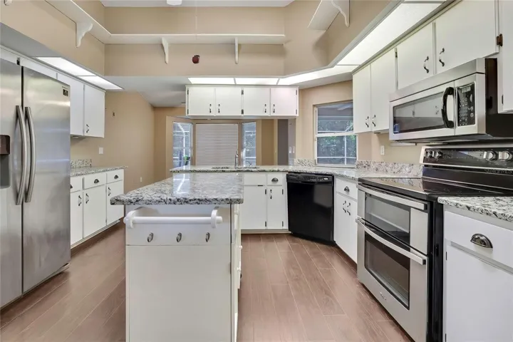 Spacious kitchen with center island and stainless-steel appliances