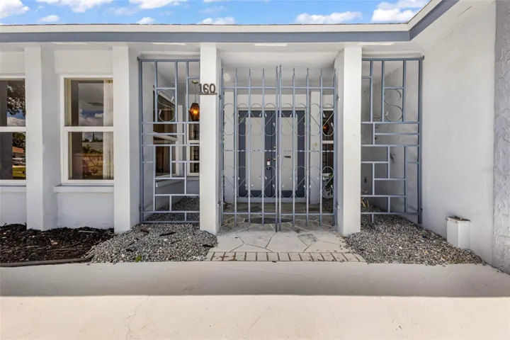 Private gated entry way to your courtyard and double entry doorway.