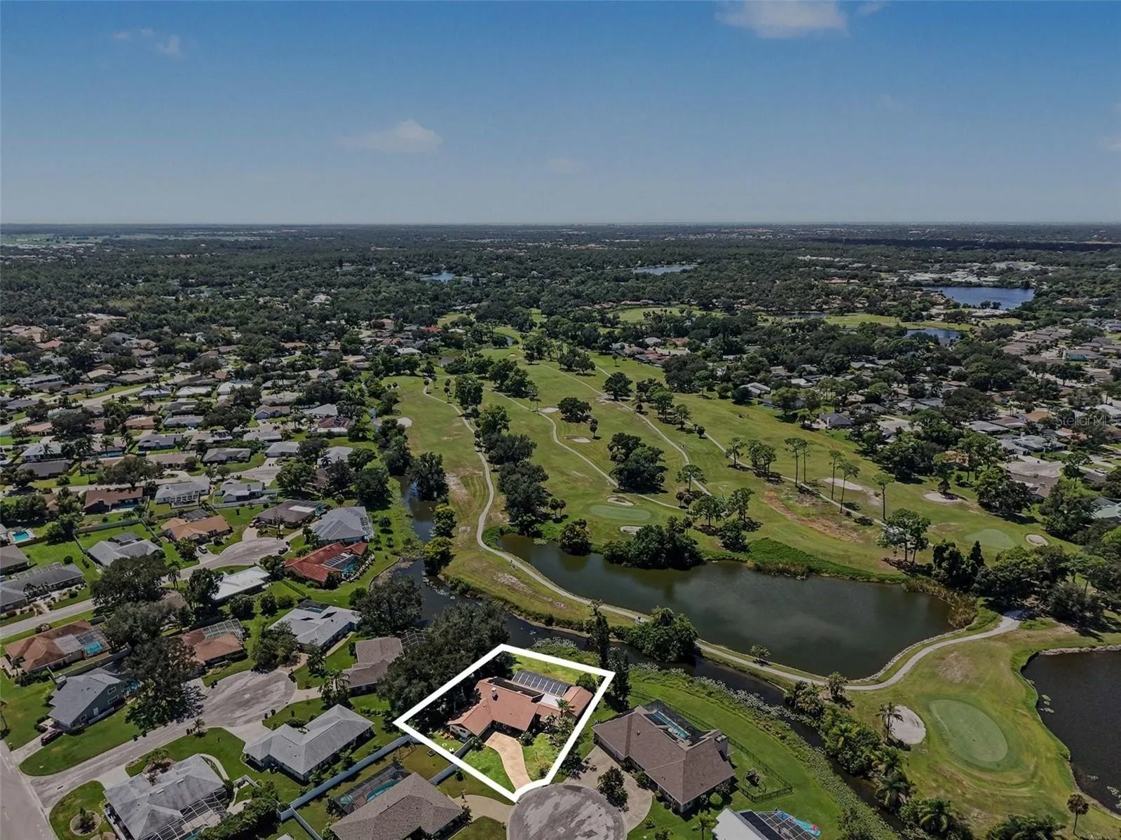 Overhead View of the Home on a Lake and Golf Course