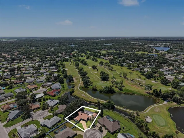 Overhead View of the Home on a Lake and Golf Course