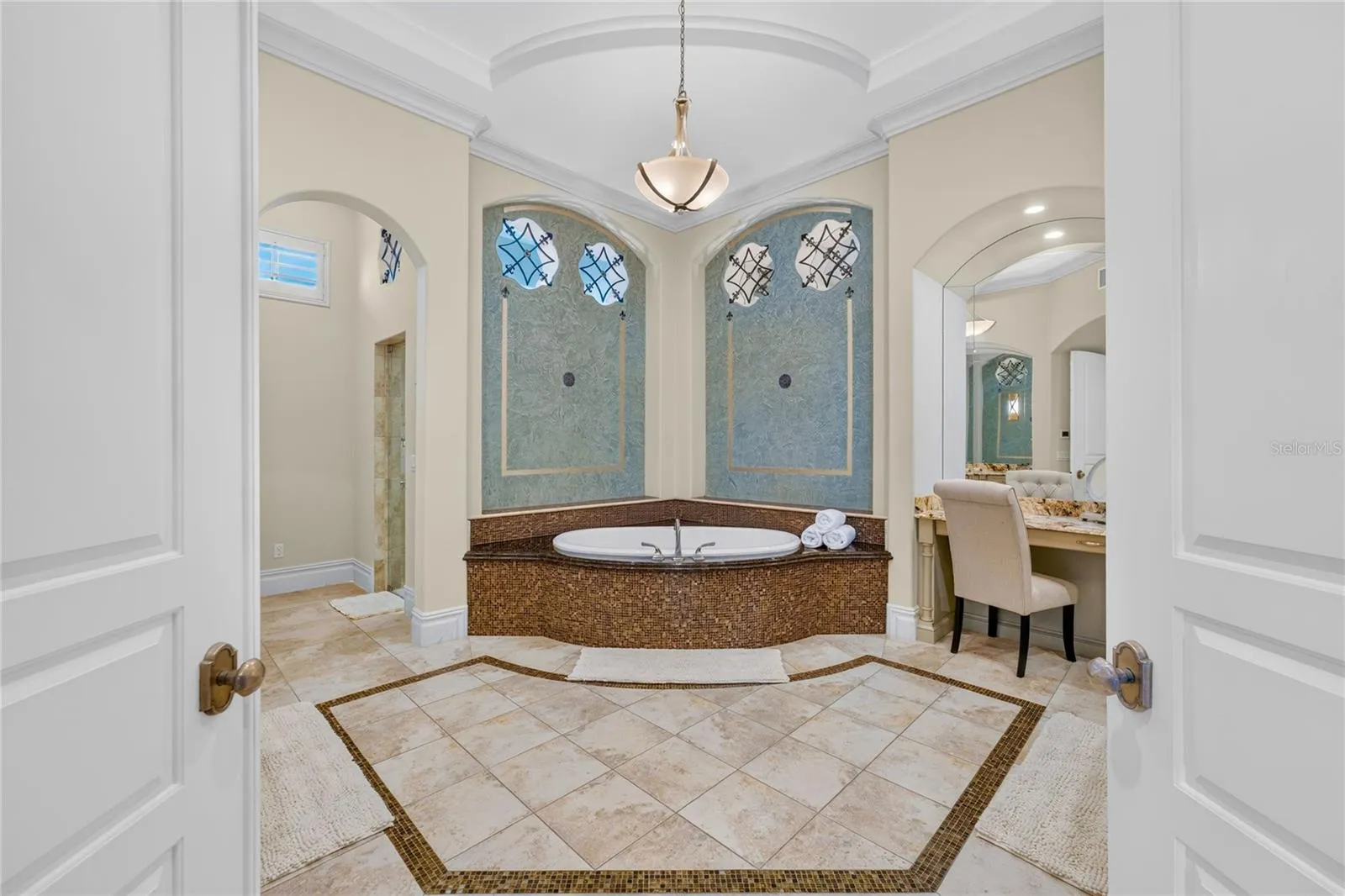 This primary bath was remodeled in 2020 and features soaking jetted spa tub, his &amp; her granite topped vanities, make-up area, STEAM multi-head shower , and toilet room with separate bidet.
