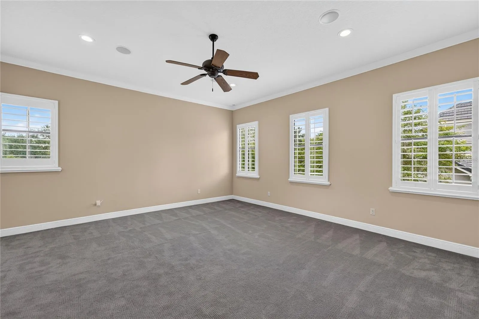 Midway up the stairs lies this large BONUS room with storage closet. The only room with carpet in the house and once used as FITNESS/WELLNESS ROOM. A flexible space for whatever your needs.
