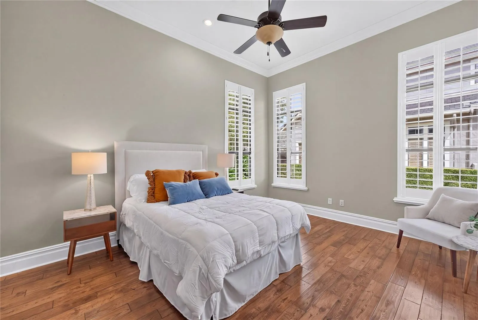 A FIRST floor Private Ensuite for visiting guests. Located in the opposite wing from Primary Suite. A full bath with large walk-in custom closet highlight this space.