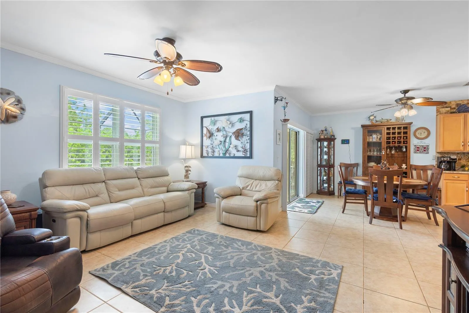 Living Room with large picture window with plantation shutters.