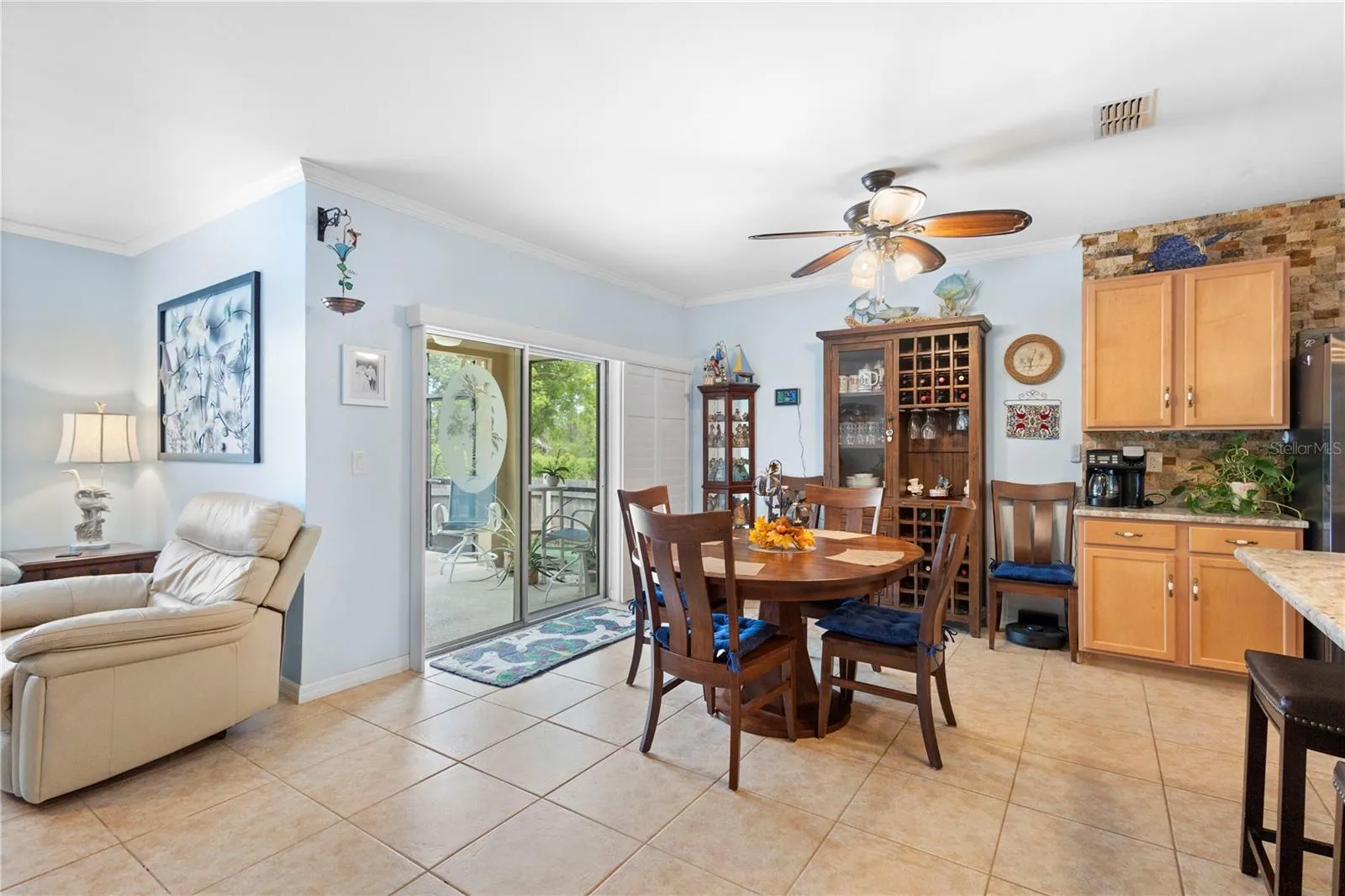 Sliding glass doors open to the pool and Lanai.