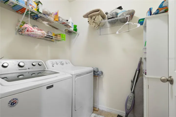 Laundry room with shelving.