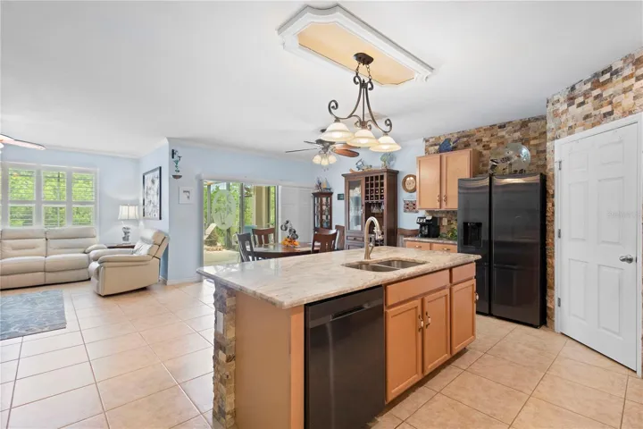 Kitchen opens to Living Room, perfect for relaxing and entertaining.