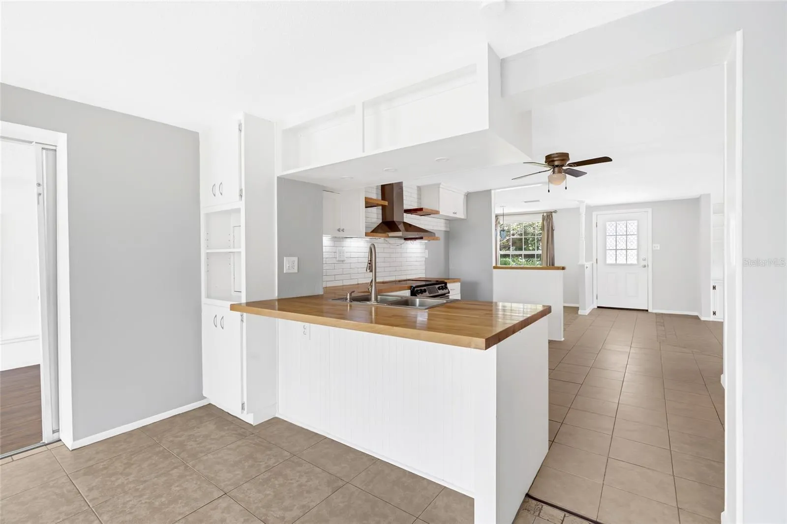 The peninsula adds casual seating, extra prep space and a natural gathering spot at the heart of the home.