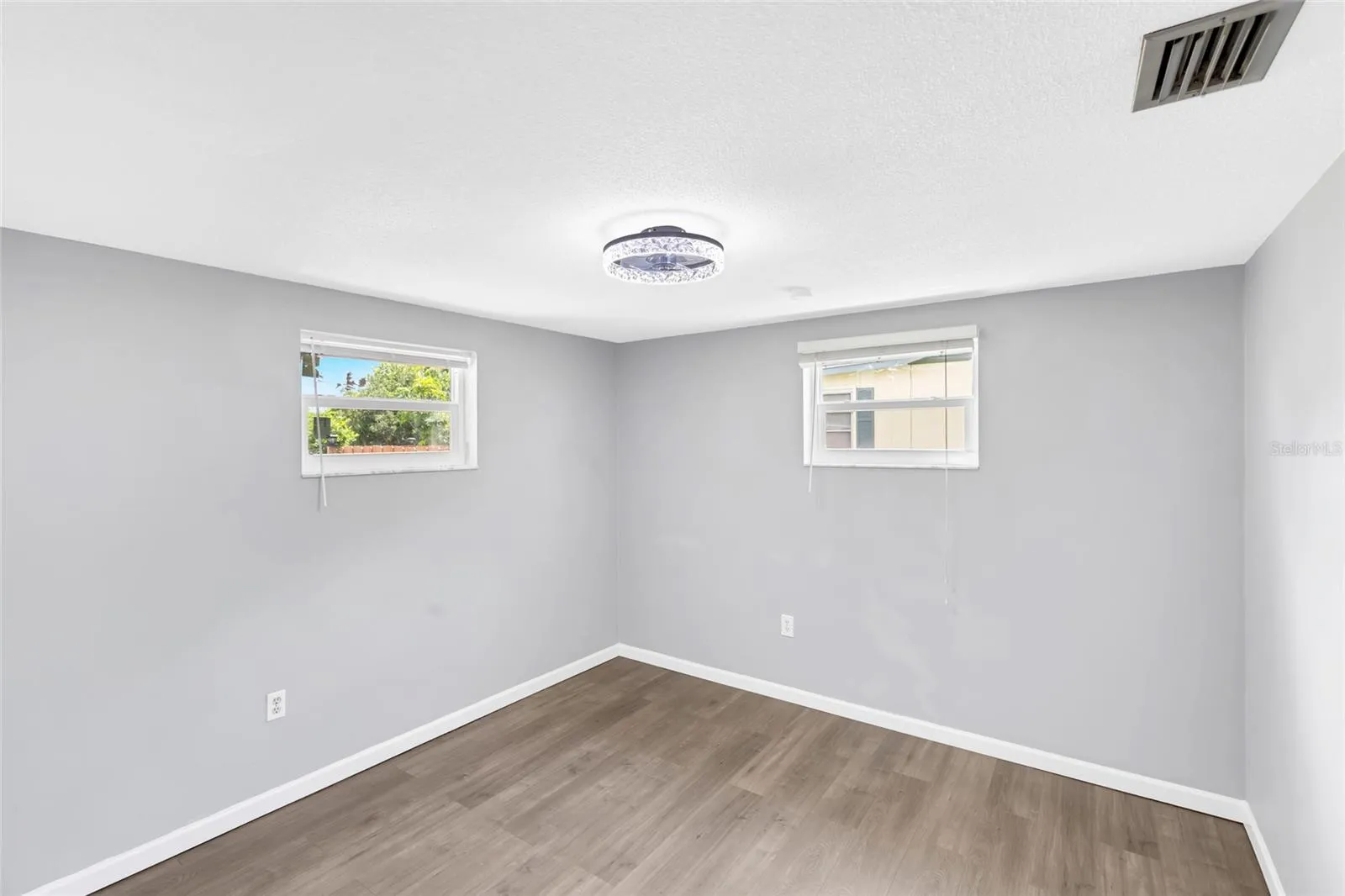 Bedroom 3 is bright and nicely sized, with two windows bringing in natural light and giving the room an open, airy feel.
