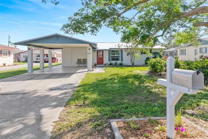 Set beneath a beautiful canopy of mature trees, this Nokomis pool home offers a relaxed coastal setting between Venice and Sarasota.