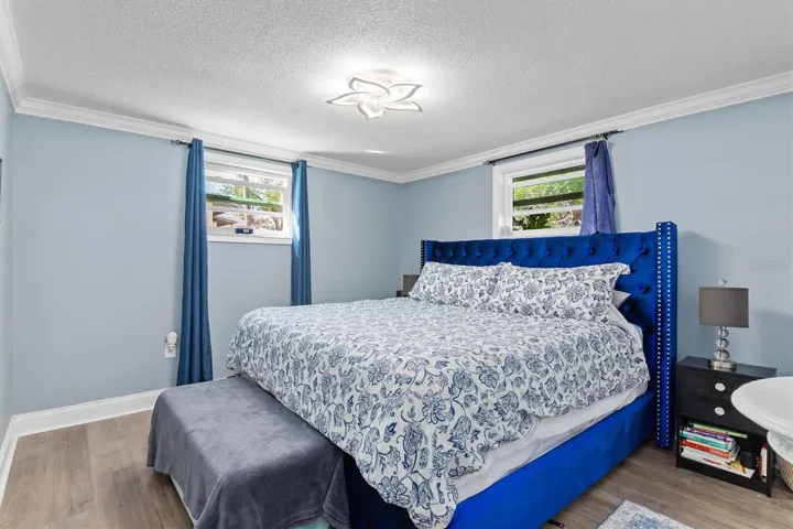 Bedroom 2 easily accommodates a King bed and additional furniture, giving guests a true bedroom rather than a space that feels like an afterthought. Photo taken during prior occupancy.