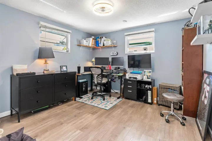 Bedroom 3 was previously used as a spacious home office, showing how easily the room can adapt for work, guests or hobbies. Photo taken during prior occupancy.