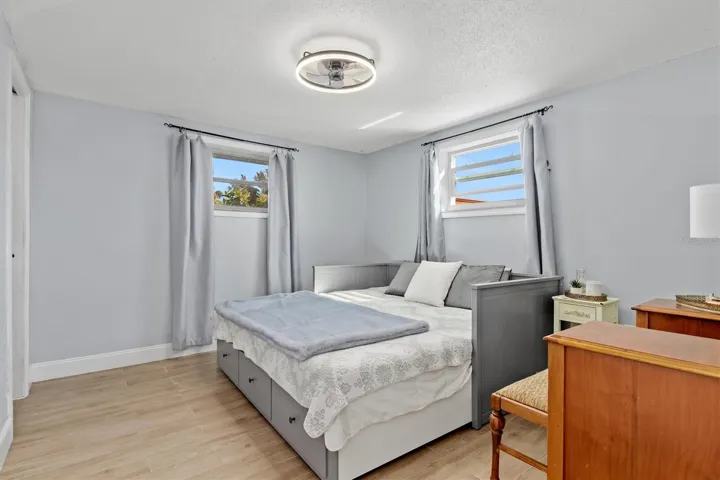 Spacious primary suite with room for a king size bed and additional furnishings, plus a walk in closet and private ensuite bath. Photo taken during prior occupancy.