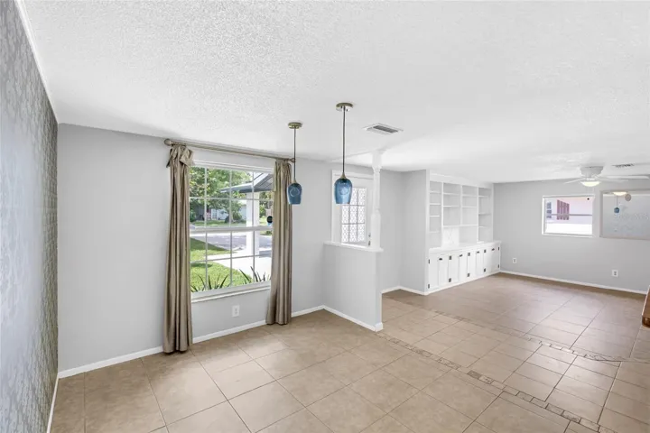 Natural light fills the dining area, with the front entry and main living room just steps away.