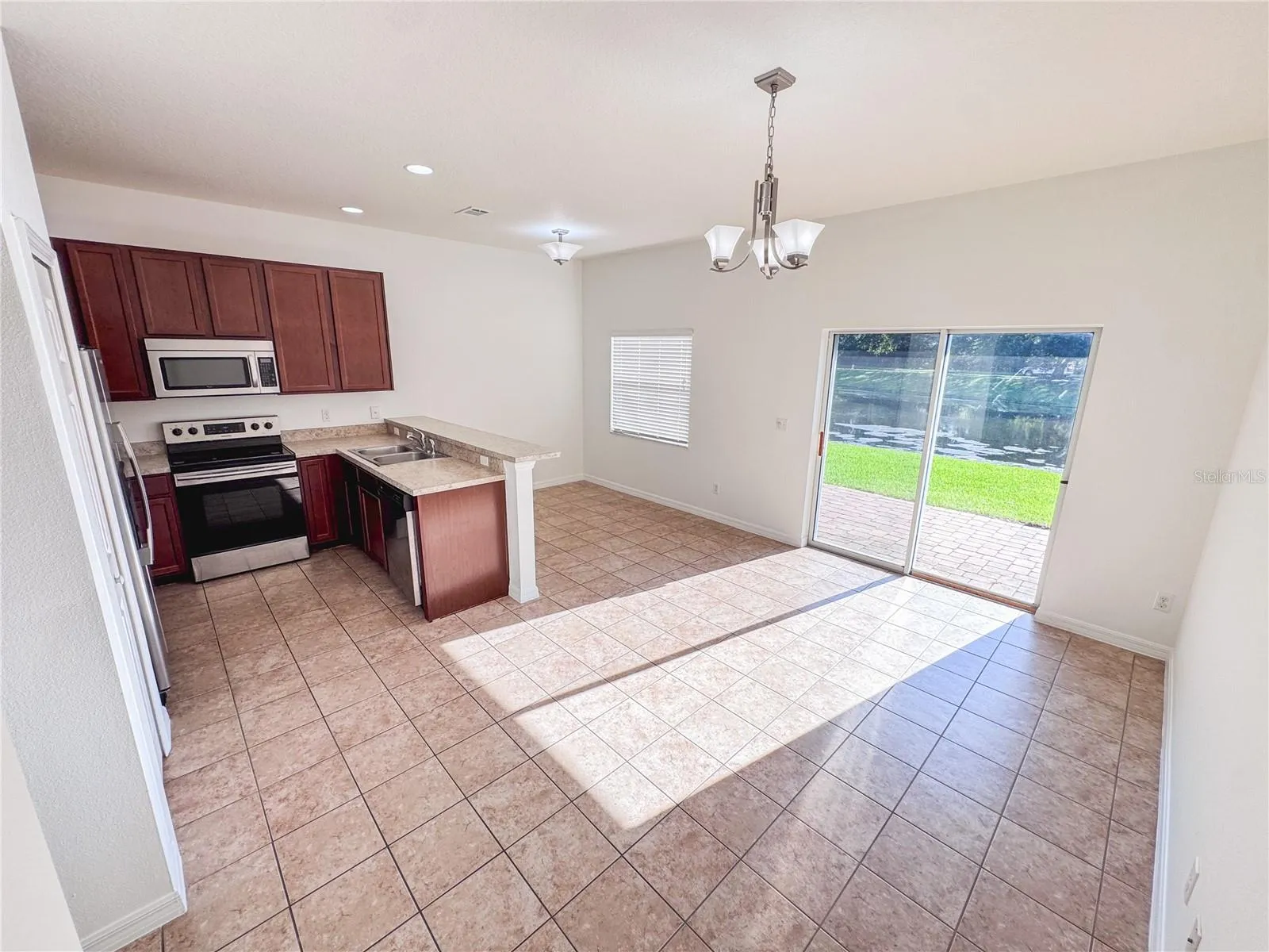 Dining Area and Kitchen with Patio Slider