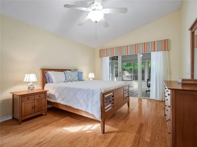 Primary bedroom with sliders to florida/office space