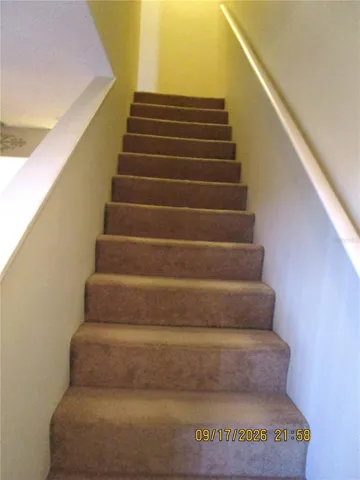 Stairs to bedrooms and 2nd floor