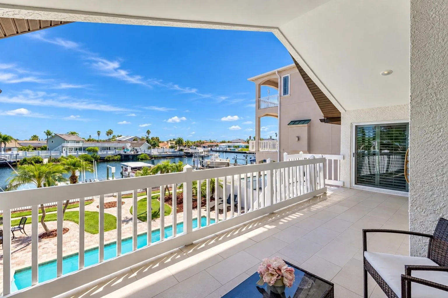 Rear balcony seating area with canal views.