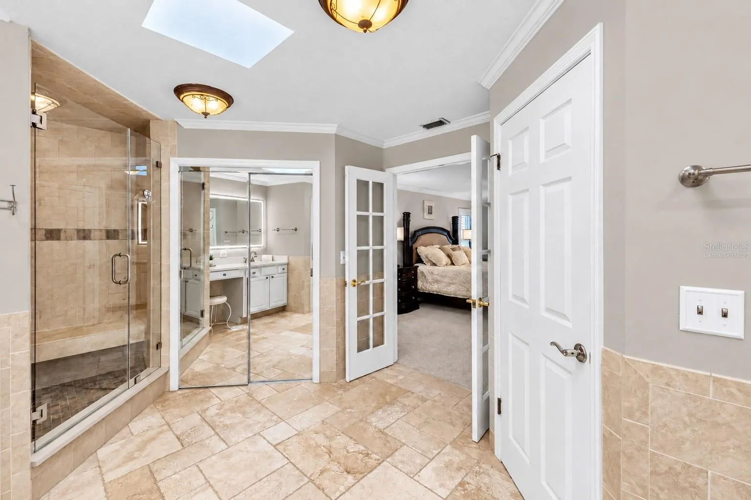 Primary bath shower and walk-in closet.